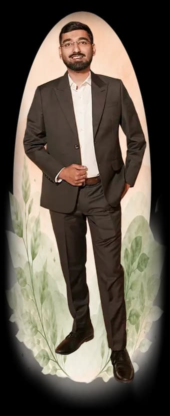 Dr. Yashasvi Verma standing in a dark suit at an indoor event